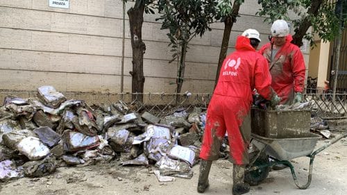 BELFOR Employees cleaning up after a flood
