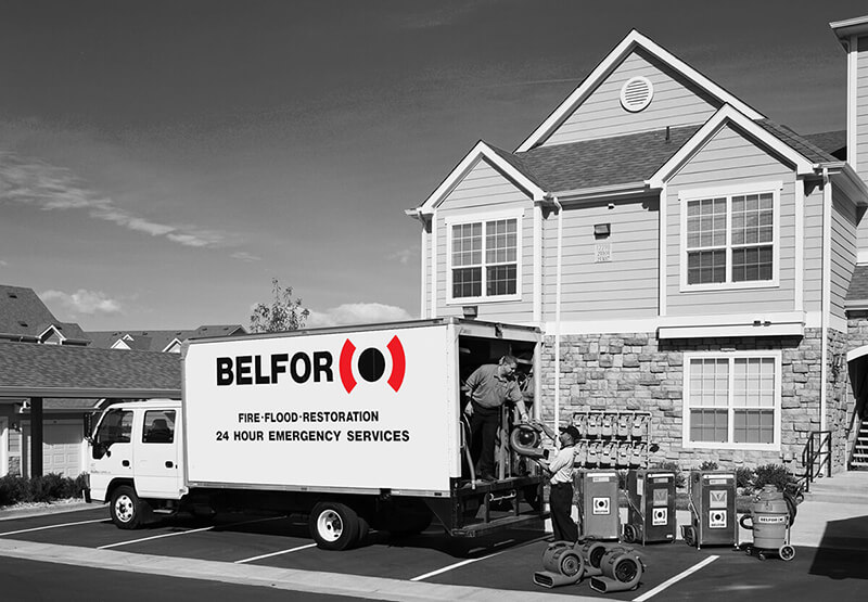 BELFOR unloads water damage recovery equipment at apartment complex