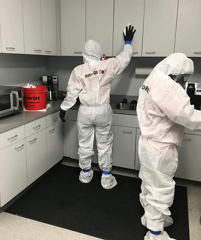 BELFOR cleaning technicians wipe down break room