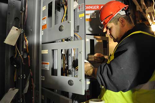 BELFOR engineer repairs electrical panel