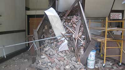 Collapsed staircase at Racine Village Hall before restoration
