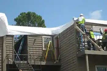shrink wrapped apartment roof