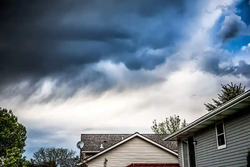 thunderstorm clouds over house