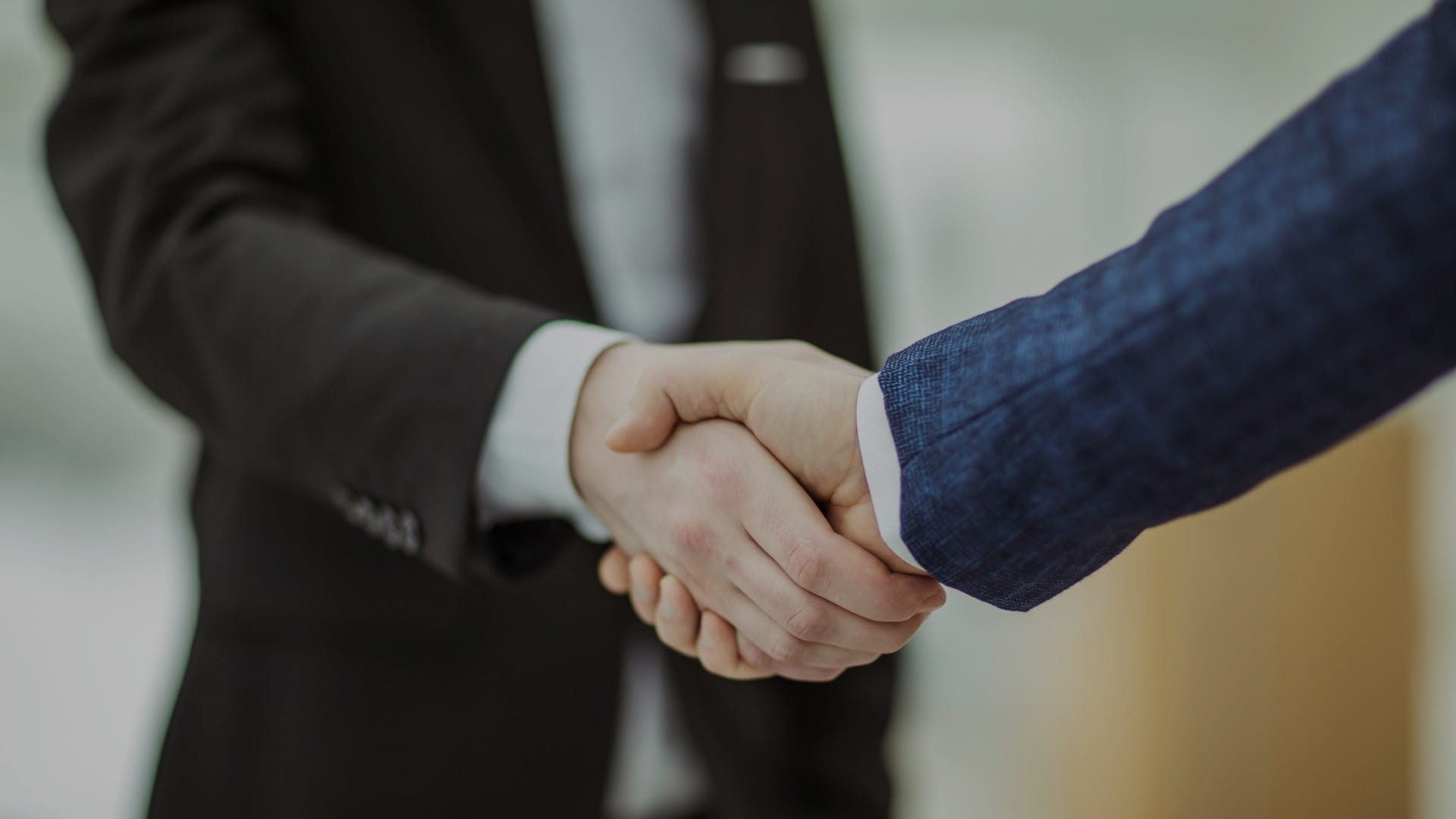 Two-man-handshaking_1920x1080px_
