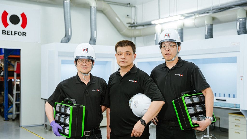 belfor-technicians-holding-boxes-while-working-in-the-workshop