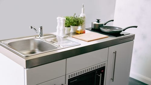 White Kitchen with utensils, pan and a sink