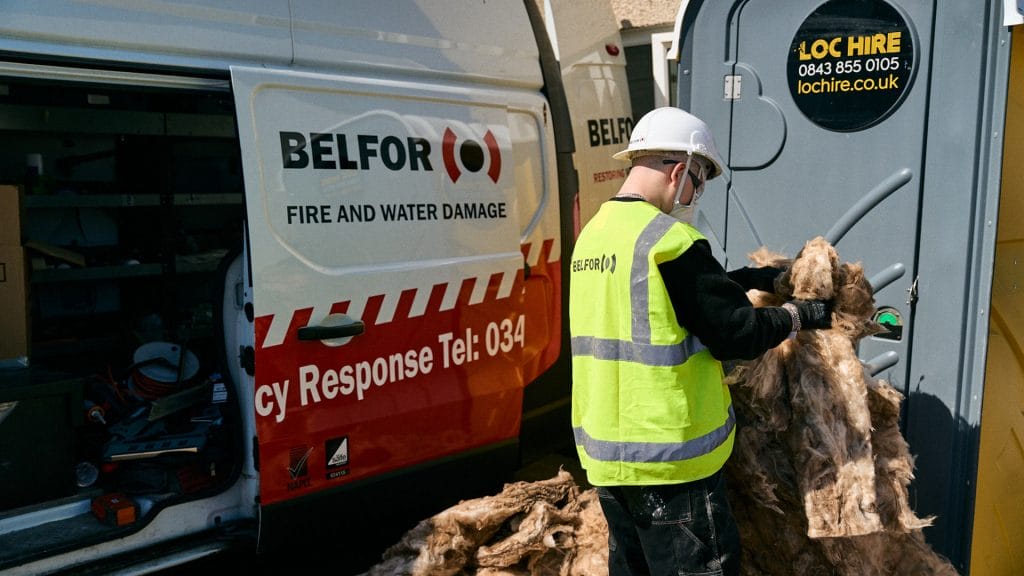 Employee disposes of insulation materials