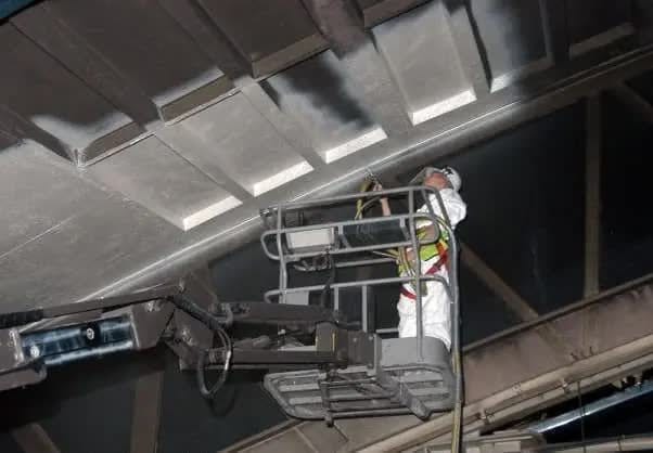 Production hall peeling of soot