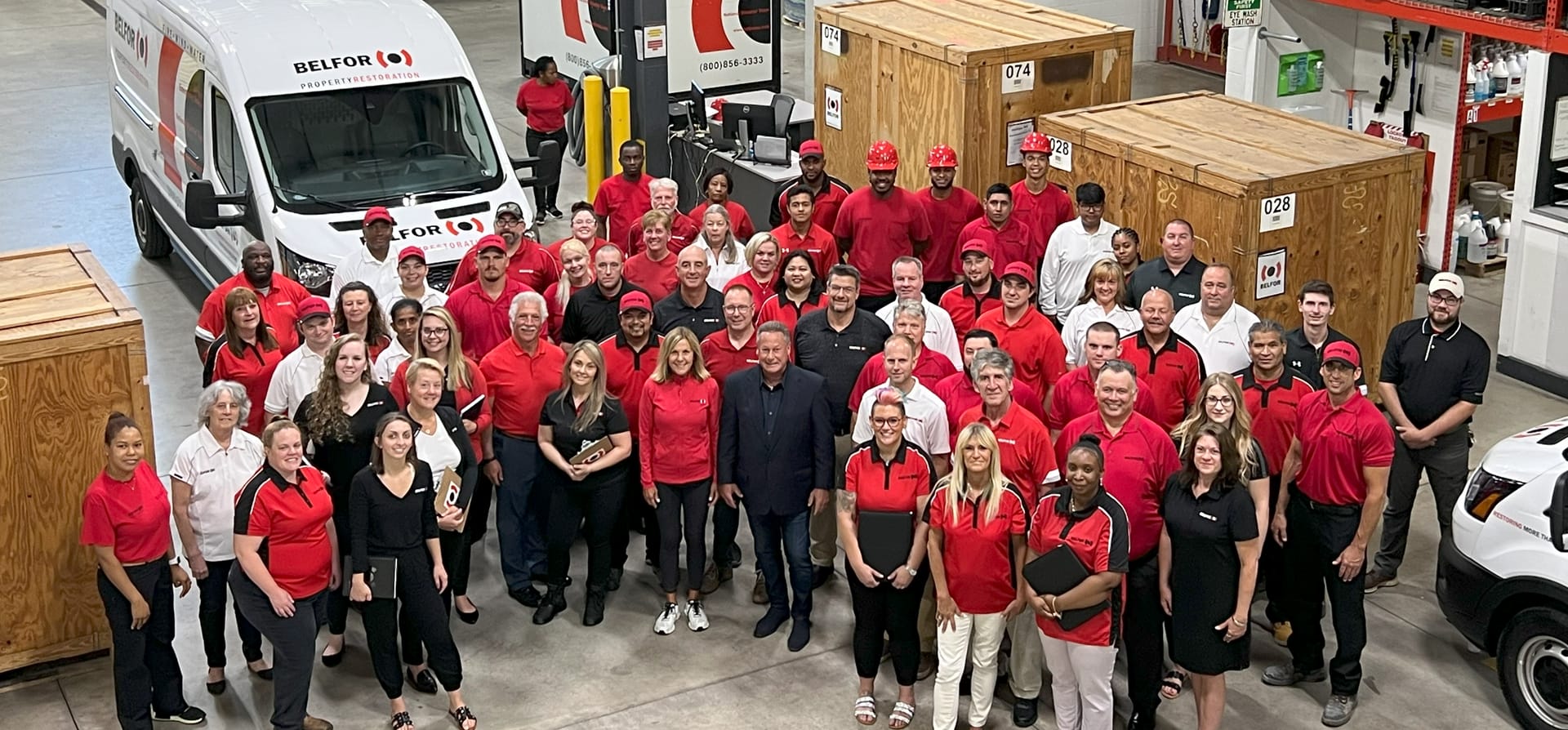 Overhead shot of BELFOR office employees in warehouse