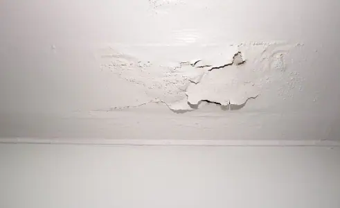 A white wall with moisture on it